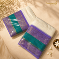 Purple and teal saree with gold zari border, packaged and ready to gift