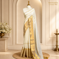 White mulcotton saree with a broad gold kasavu border